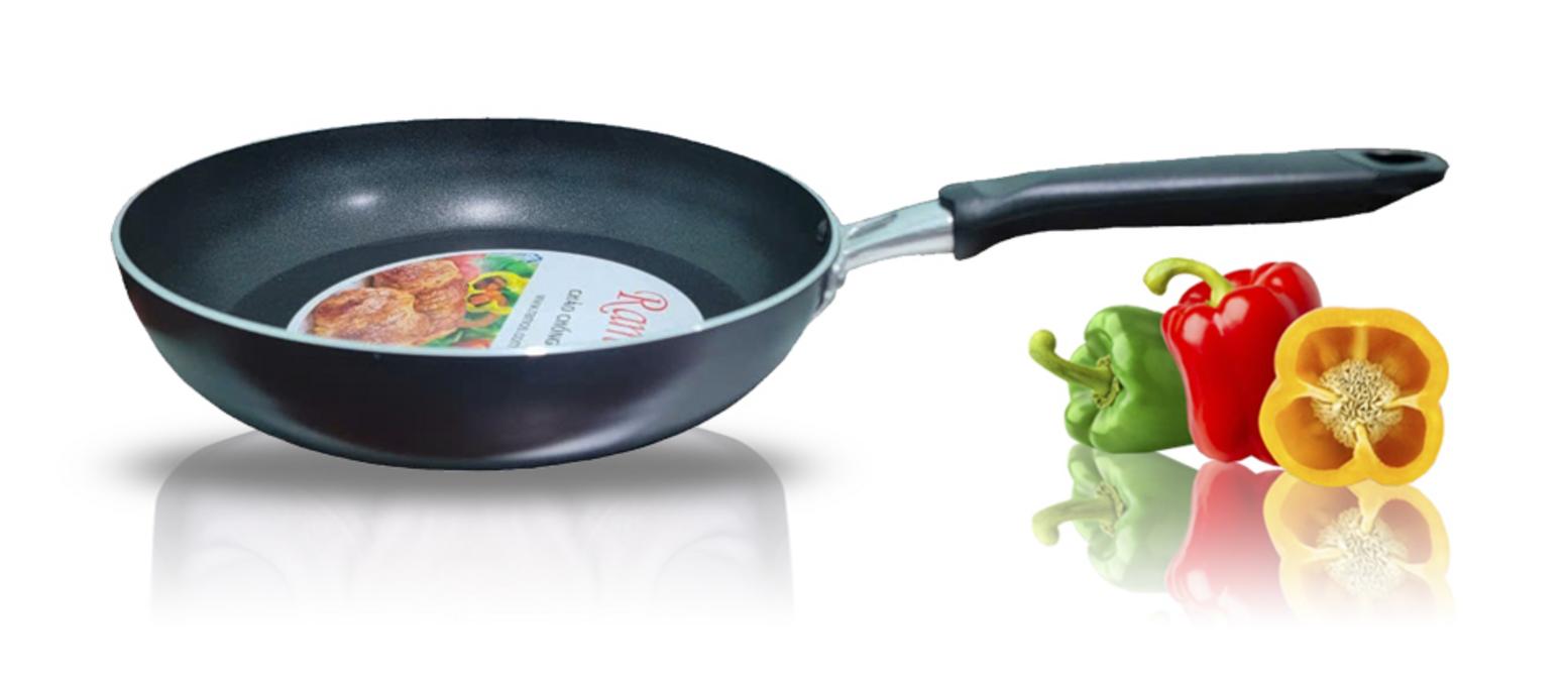 a sleek black non-stick frying pan with aluminum handle on an induction cooktop in a modern kitchen