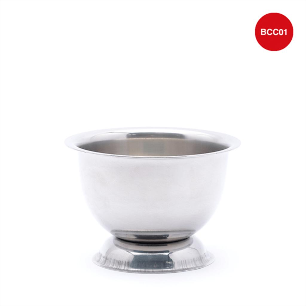 close up of hands using stainless steel mortar and pestle clear view of product features