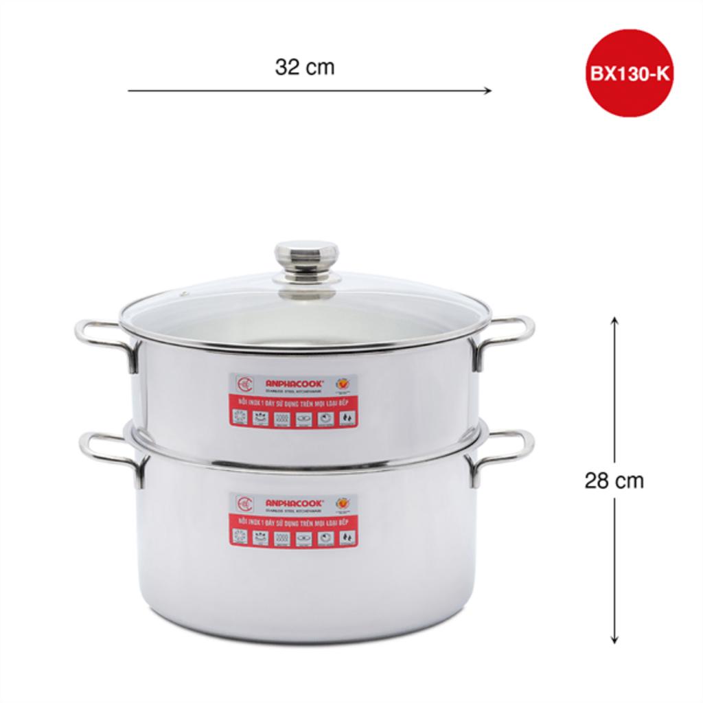 Close-up of stainless steel pot bottom, bright shiny surface, glass lid steaming food visible