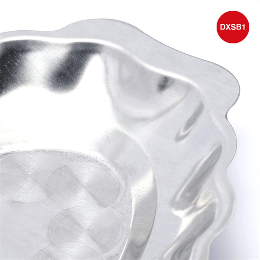 Hands washing and drying a stainless steel deep mango-shaped plate in kitchen sink with soap foam