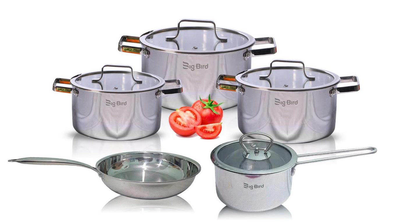 stainless steel cookware set with 5 pieces including pots and pans modern kitchen setting close up on stainless steel surface and glass lid