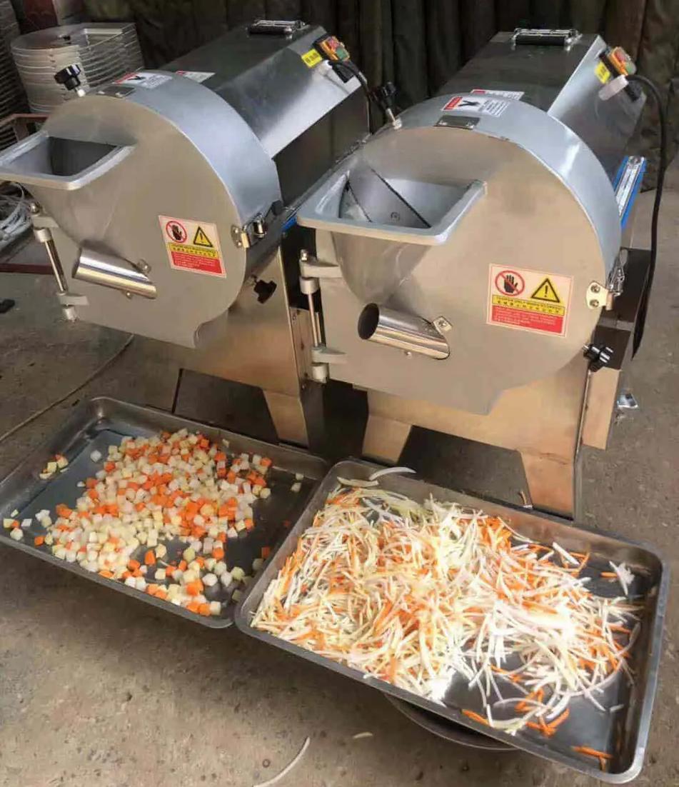 Máy thái rau củ YQC-802 đang vận hành trong một bếp ăn công nghiệp lớn.